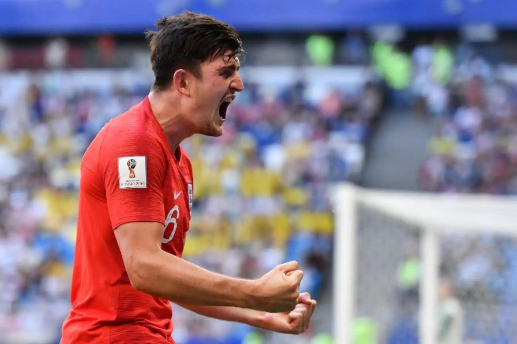 El defensor de Inglaterra Harry Maguire celebra después de marcar el primer partido de la Copa del Mundo de Rusia 2018 en el partido de cuartos de final entre Suecia e Inglaterra.Foto:AFP