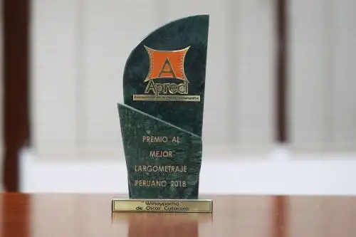 Trofeo a "Wiñaypacha", de Oscar Catacora, como la mejor película del año 2018, de acuerdo con la Asociación Peruana de Prensa Cinematográfica.