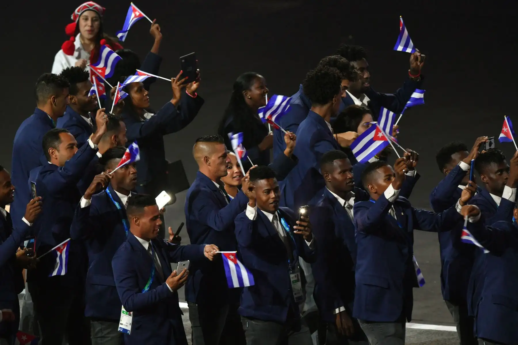 Miembros de la delegación de Cuba participan en el Desfile de las Naciones durante la ceremonia de apertura de Lima 2019.Foto.AFP