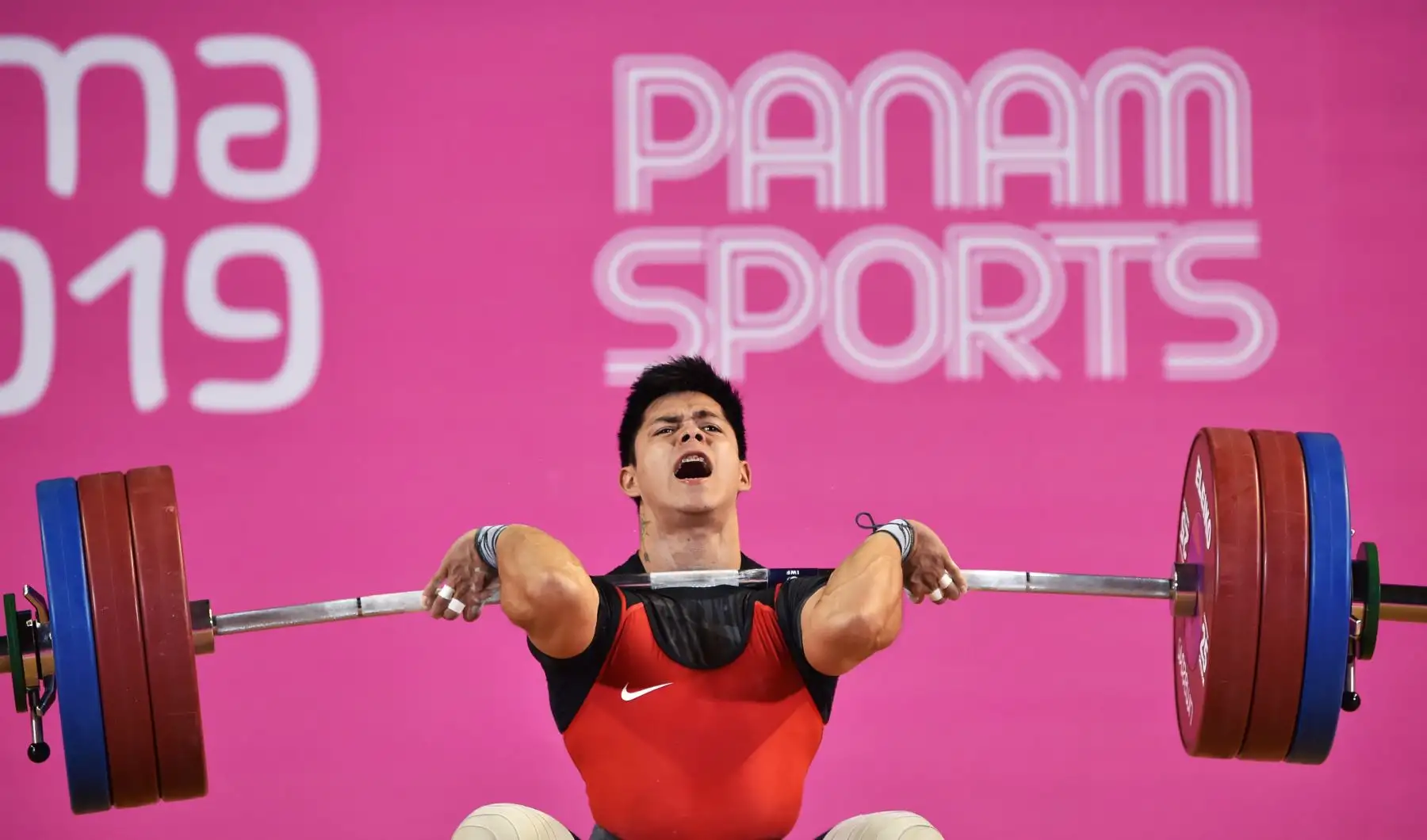 Luis David Bardalez, de Perú, logra la medalla de bronce en la disciplina de  Levantamiento de pesas de los Juegos Panamericanos de Lima 2019.
Foto: AFP