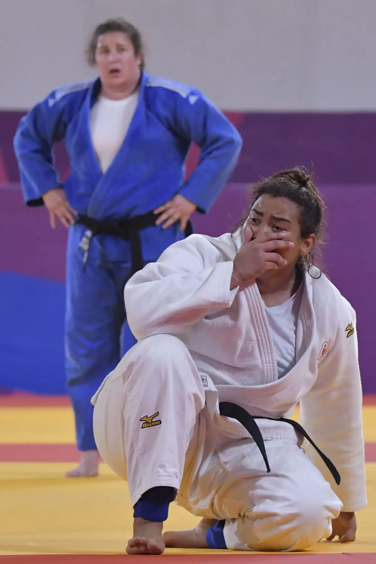 La peruana-venezolana Juliana Bolívar (R) reacciona después de derrotar a la estadounidense Nina Cutro-Kelly durante una pelea por la Medalla de Bronce Femenina de +78 kg en los Juegos Panamericanos en Lima 2019. Foto: AFP