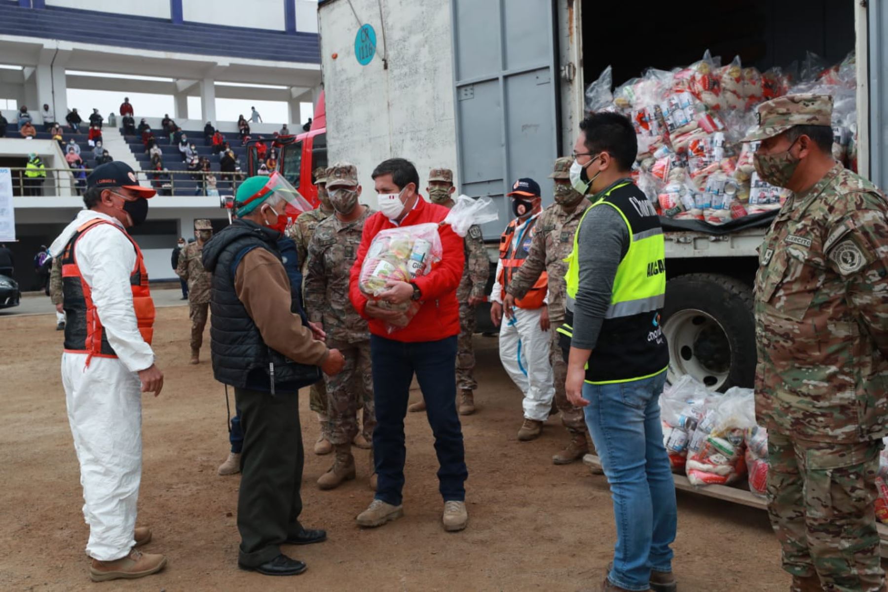 Defense Minister Jorge Chavez delivers food baskets in Lima