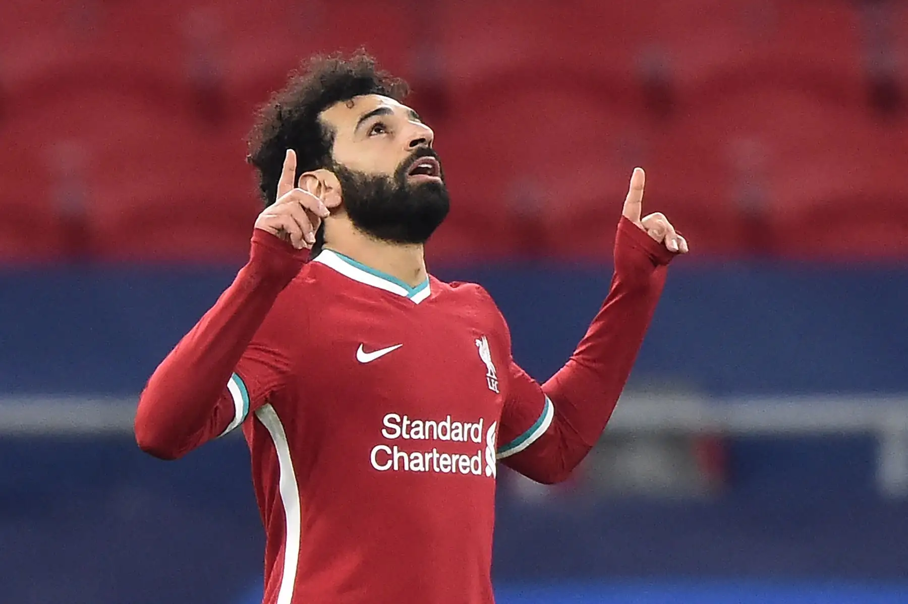 El centrocampista egipcio del Liverpool, Mohamed Salah, celebra anotar el primer gol de su equipo durante partido porla Liga de Campeones de la UEFA. Foto: AFP
