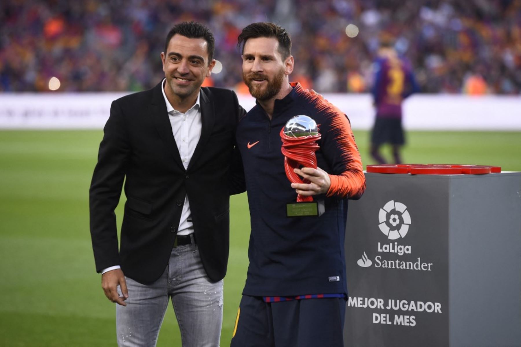 Lionel Messi y Xavi Hernández