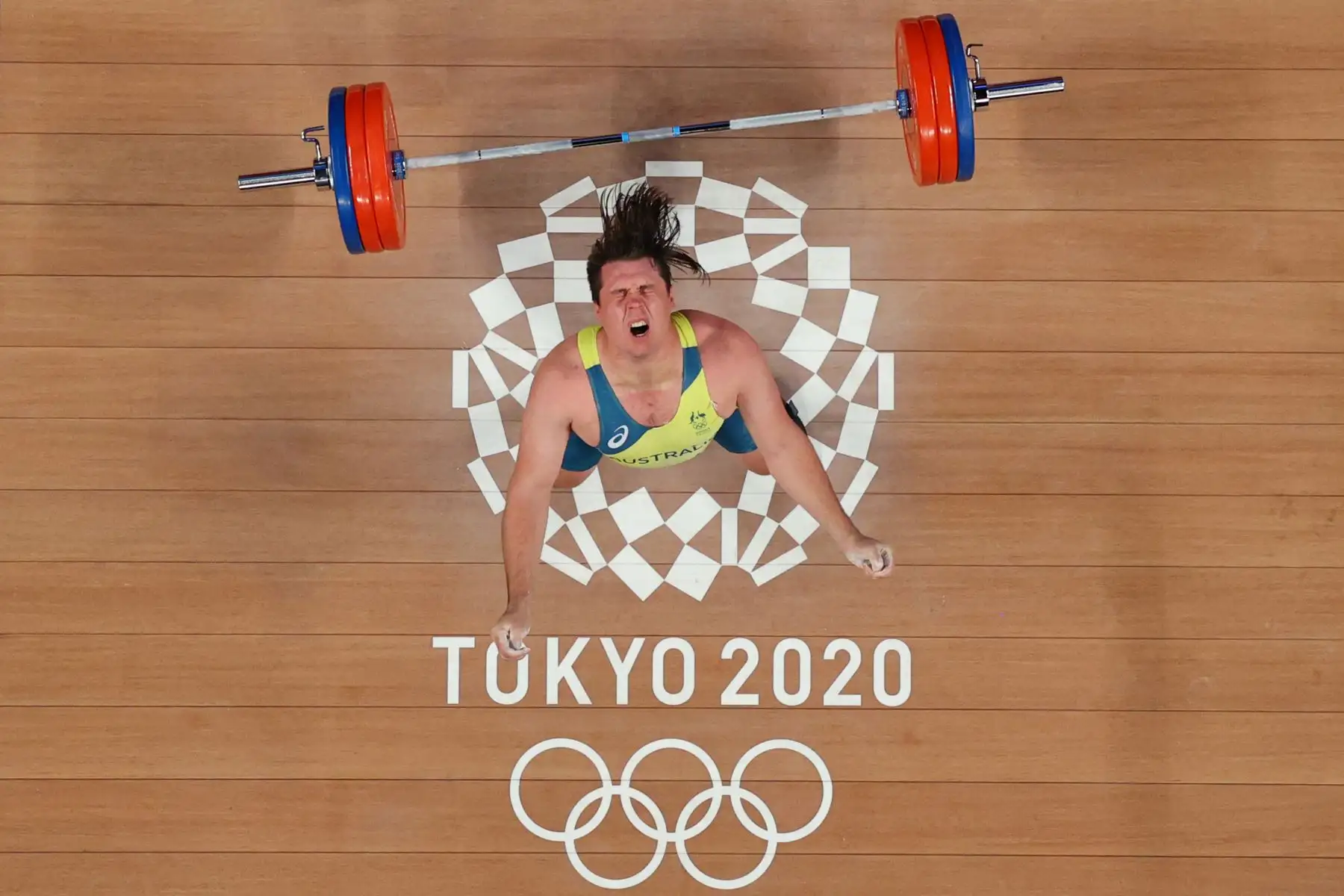 El australiano Matthew Ryan Lydement reacciona después de fallar un intento durante la competencia de halterofilia masculina de 109 kg durante los Juegos Olímpicos de Tokio 2020.

Foto: AFP