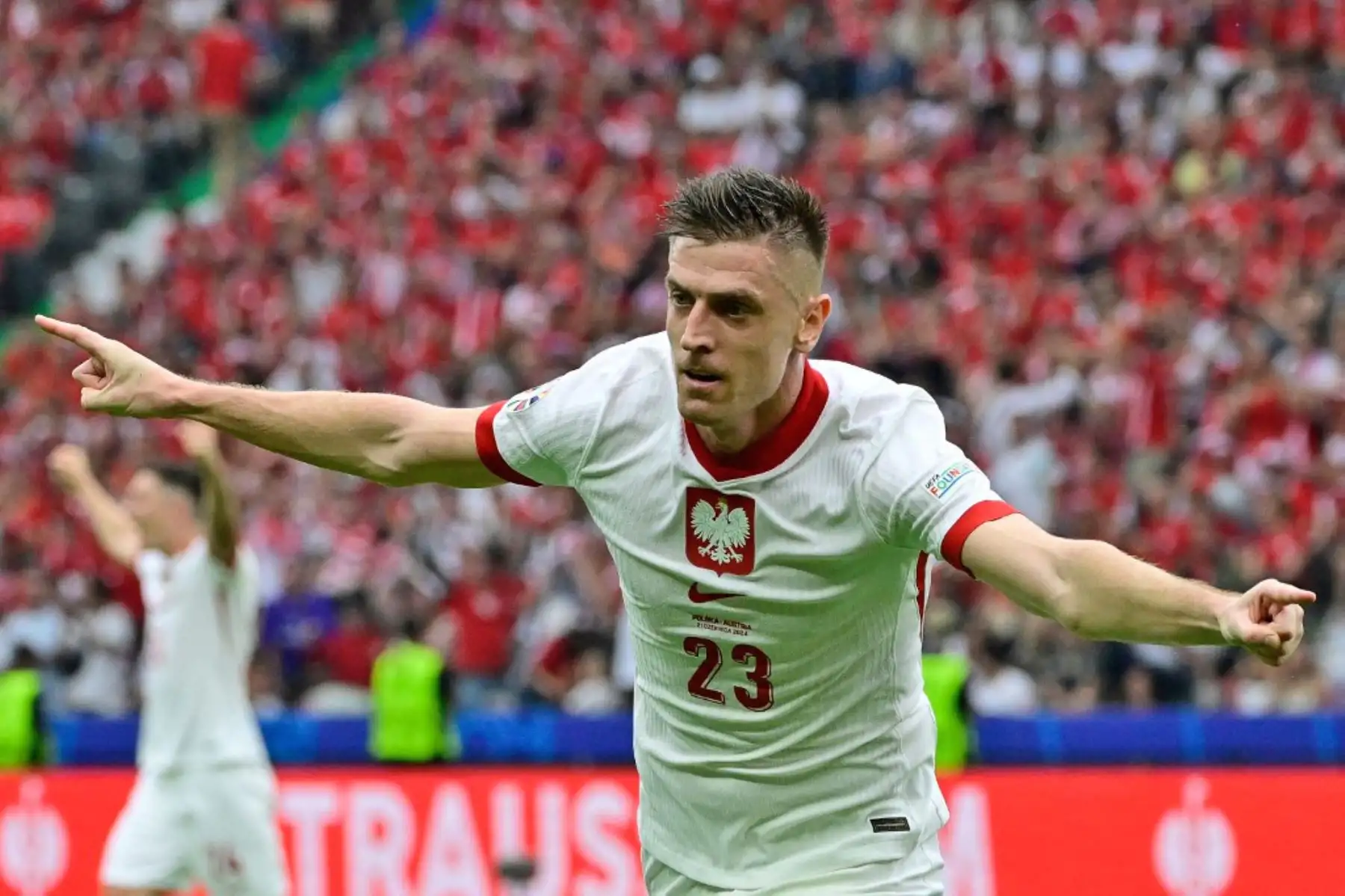 El delantero polaco Krzysztof Piatek celebra tras marcar el primer gol de su equipo durante el partido  del Grupo D de la UEFA Euro 2024 entre Polonia y Austria en el Estadio Olímpico de Berlín el 21 de junio de 2024. Foto: AFP