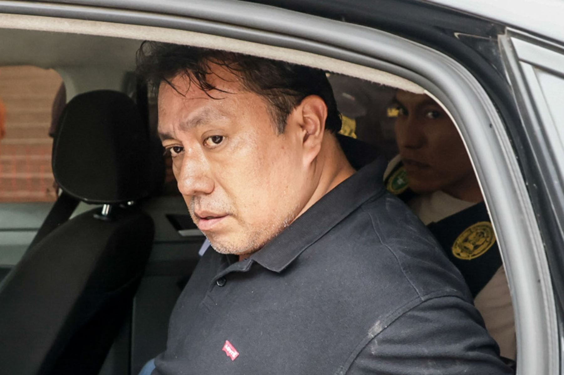 La Policía Nacional traslada a la sede de la Dirincri al gerente de Gestión Electoral de la Oficina Nacional de Procesos Electorales (ONPE), José Samamé Blas. Foto: ANDINA/Luis Iparraguirre