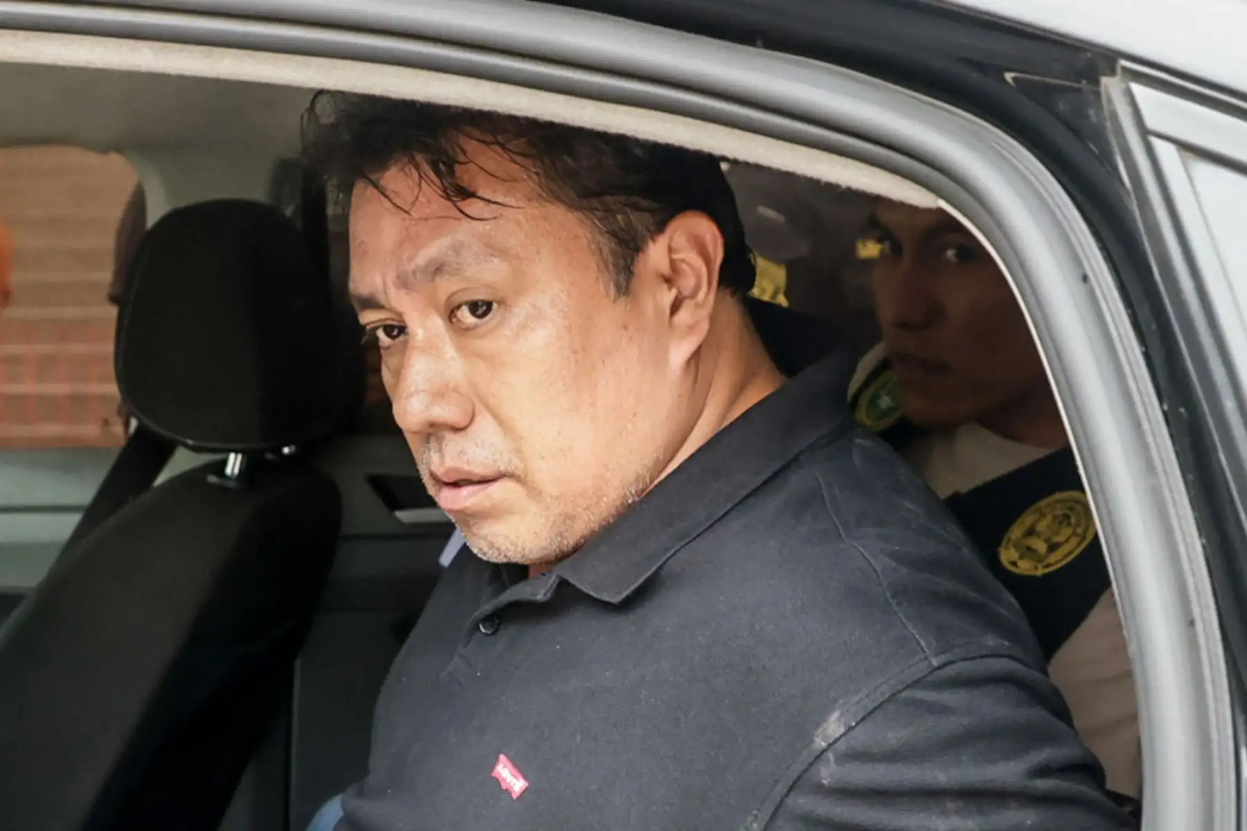 La Policía Nacional traslada a la sede de la Dirincri al gerente de Gestión Electoral de la Oficina Nacional de Procesos Electorales (ONPE), José Samamé Blas. Foto: ANDINA/Luis Iparraguirre