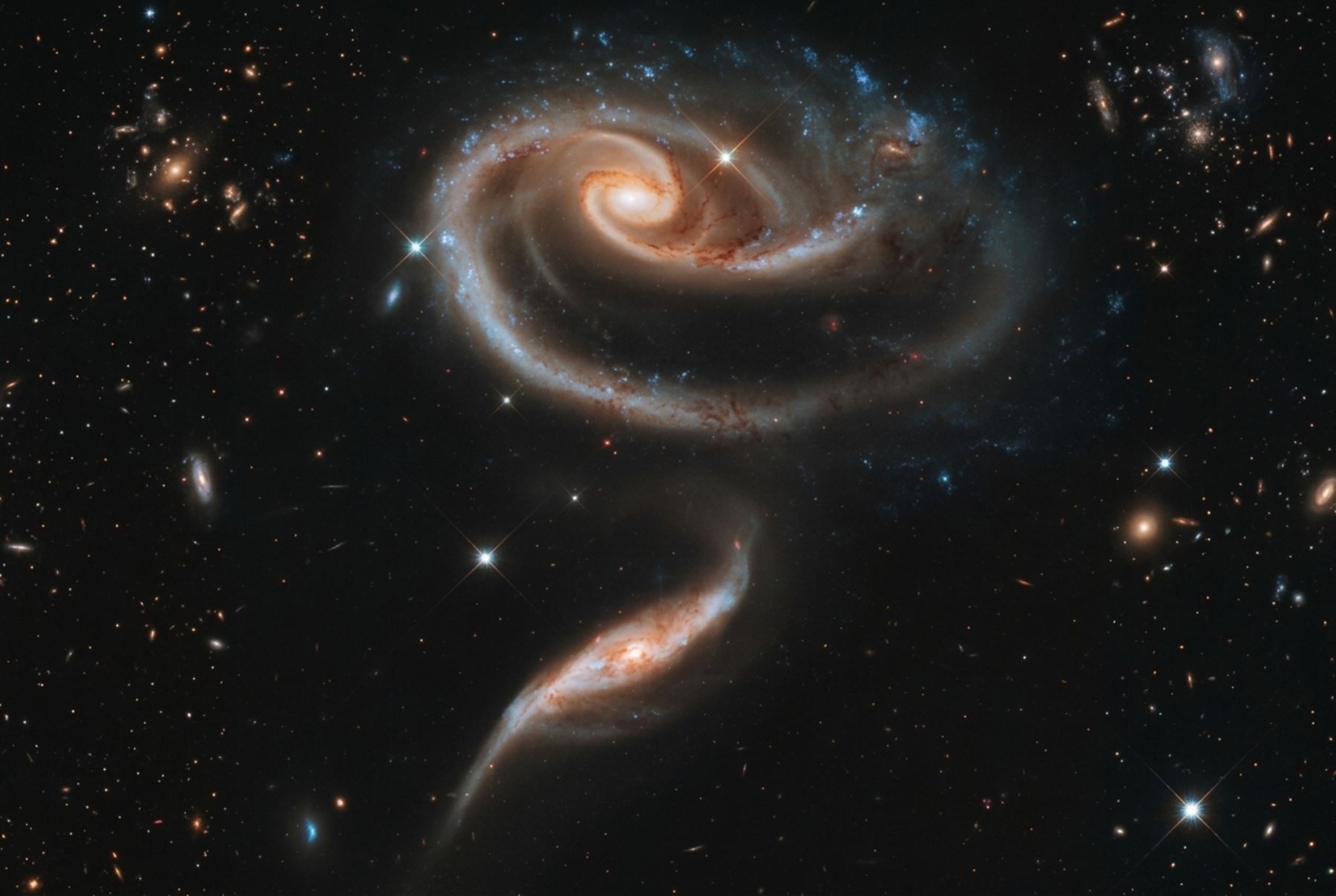 Telescopio espacial Hubble captó imagen de un par de galaxias en forma de una rosa